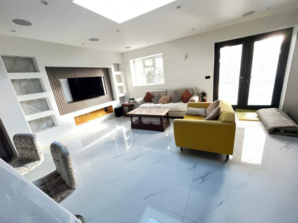 Living room furniture being moved from a ground floor flat during a removals service in Newbury Berkshire